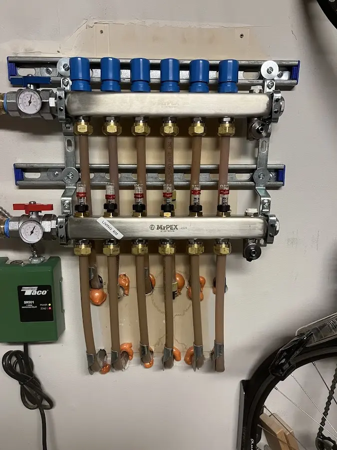 Plumber performing Water Heater Repair at a residential property in Fruita